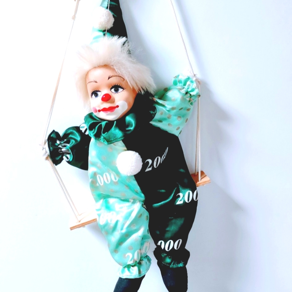 Vintage Porcelain Head Clown Doll body sitting on a Swing Hand painted